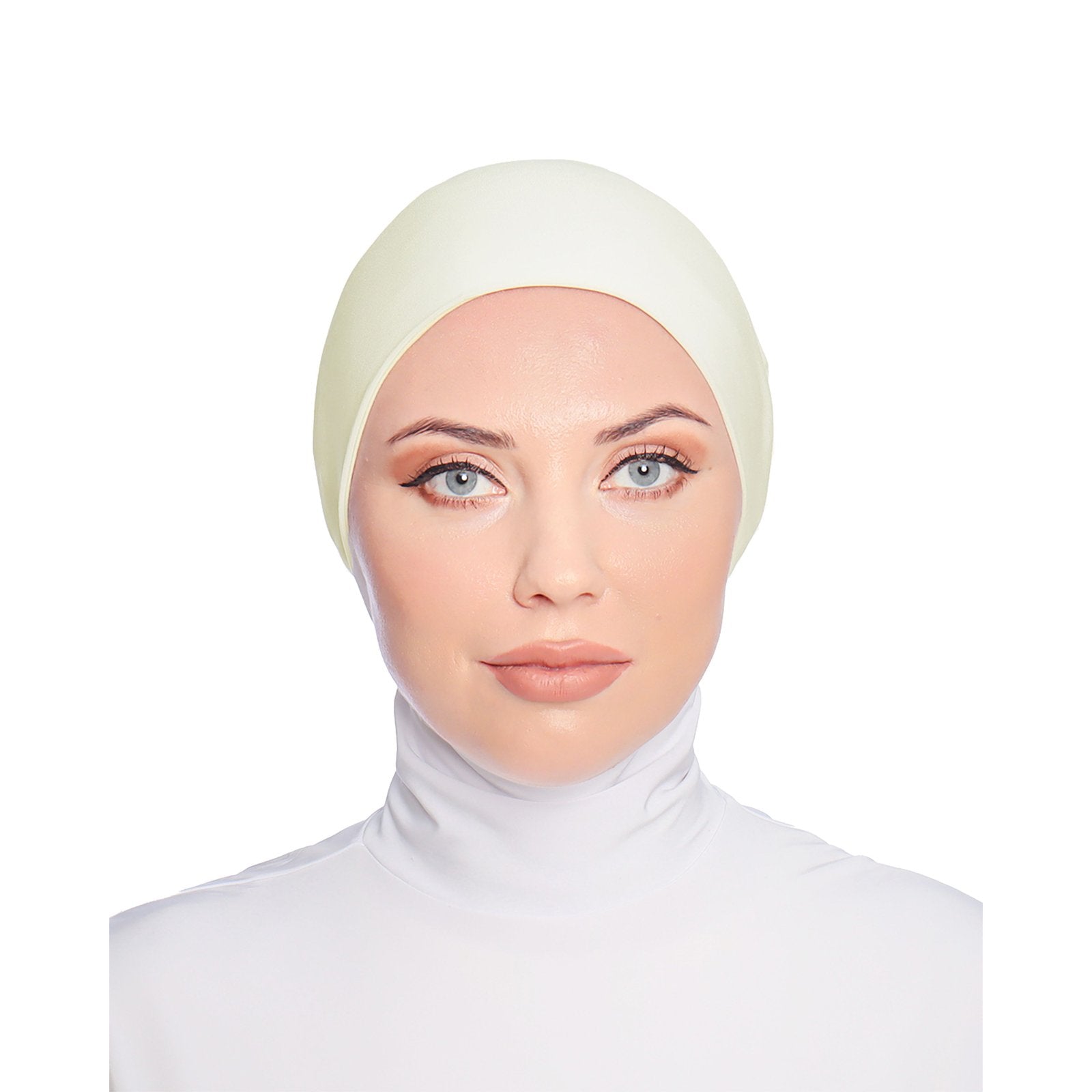 Model showcasing an ivory-colored hijab cap, providing a smooth and comfortable base layer.