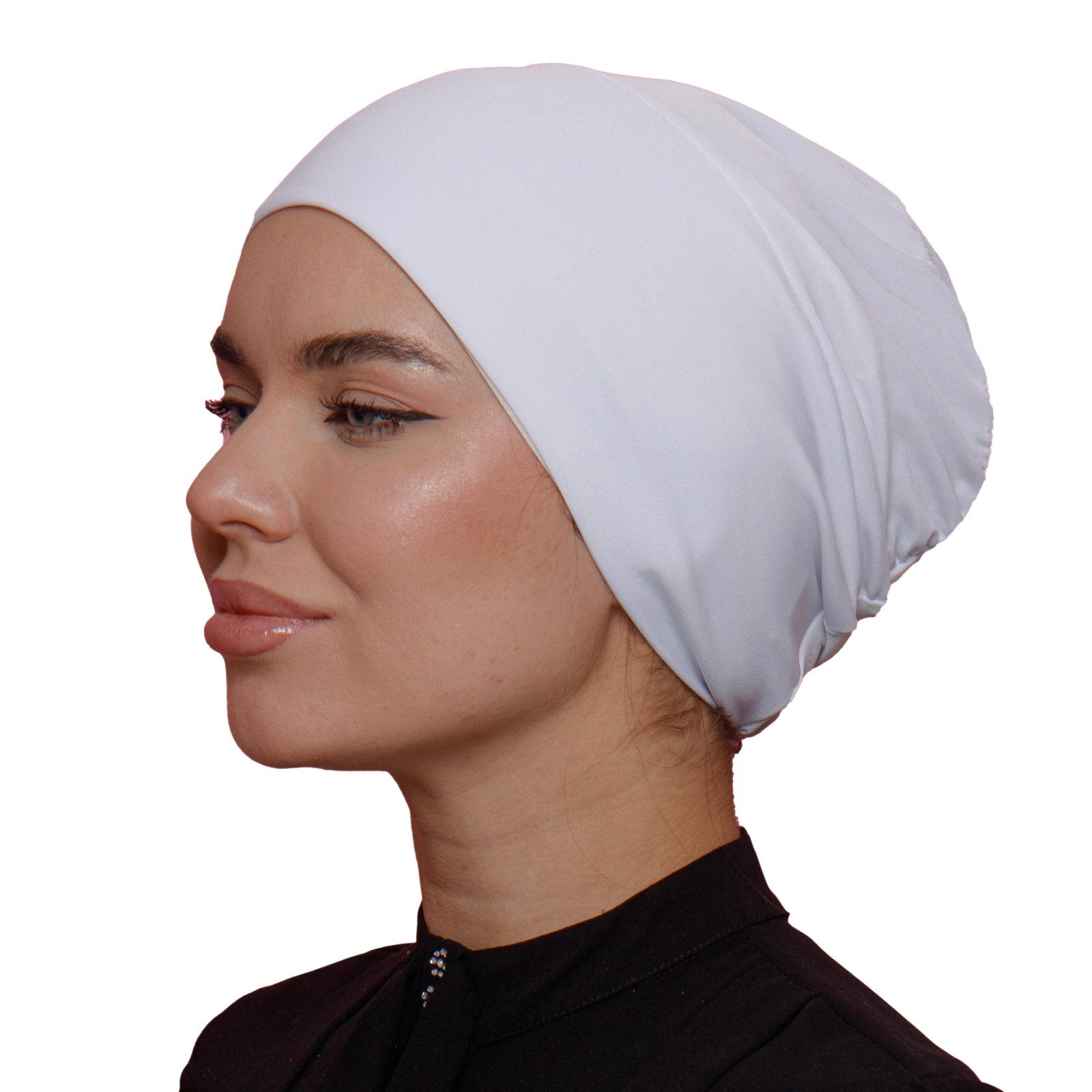 Side profile of a woman in a white lycra underscarf. Sleek and smooth design, perfect for a no-slip fit under hijabs.