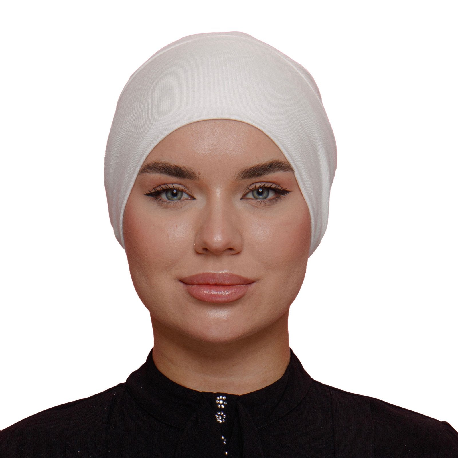 Front view of a woman wearing a white underscarf. Comfortable, breathable, and ideal for securing hijabs in place for all-day wear