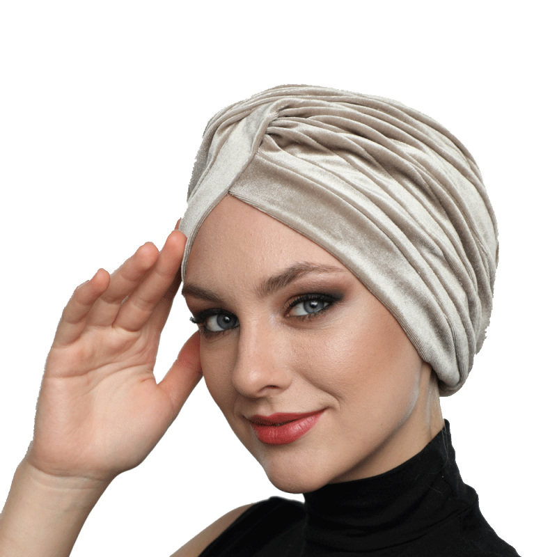 Beige striped turban with a twist-front detail, combining comfort and chic style for modern hijabi fashion.