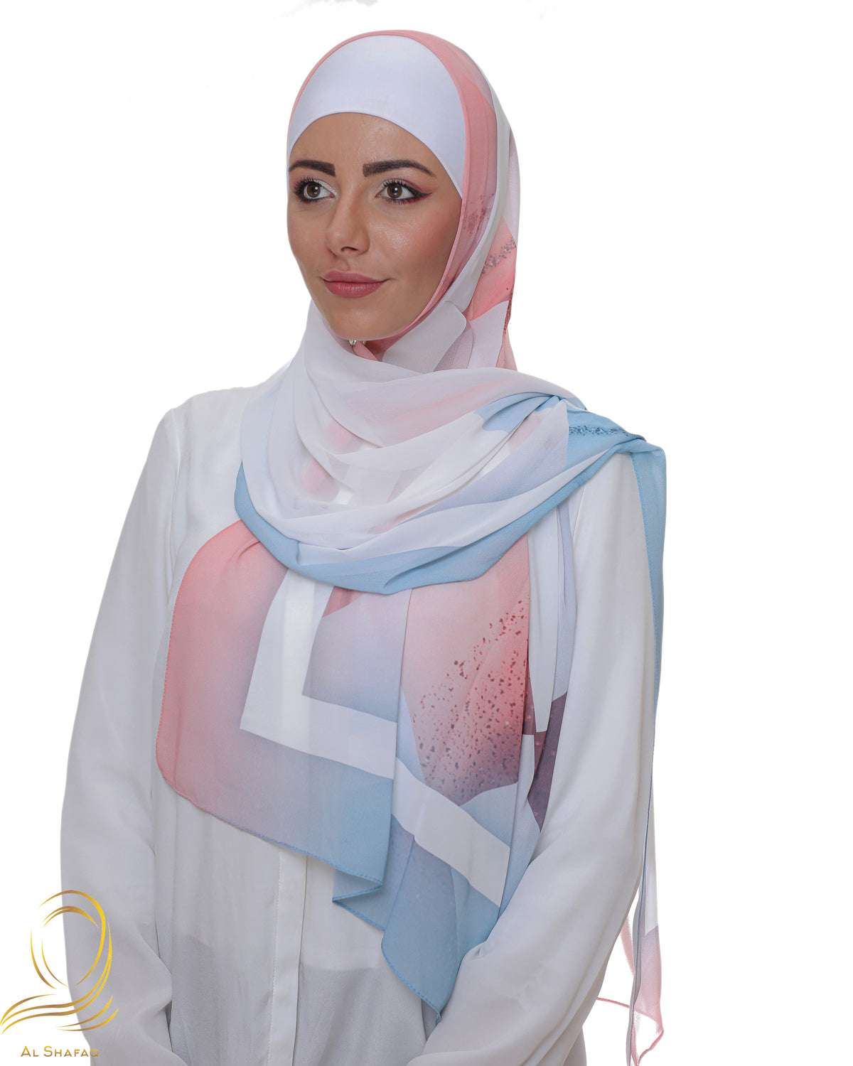 Model showcasing a pastel hijab with soft geometric patterns, ideal for contemporary styles.