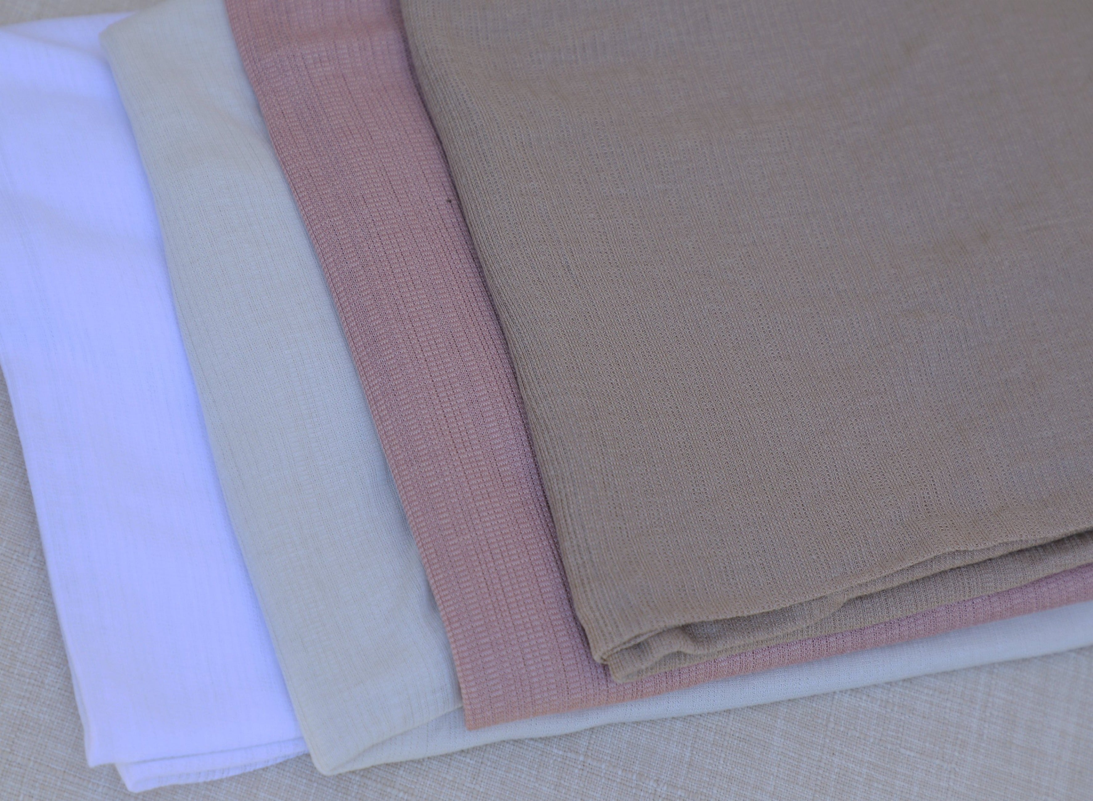Stylish Lined hijab with a fabric texture stacked with different hijab colors: white, light beige, pink and light brown