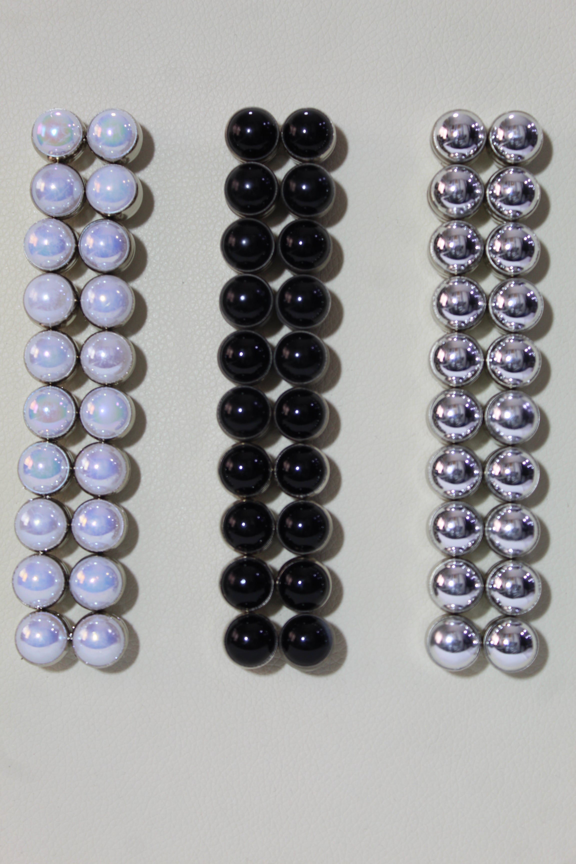 A collection of hijab magnets in various colors, combining functionality with a touch of style.