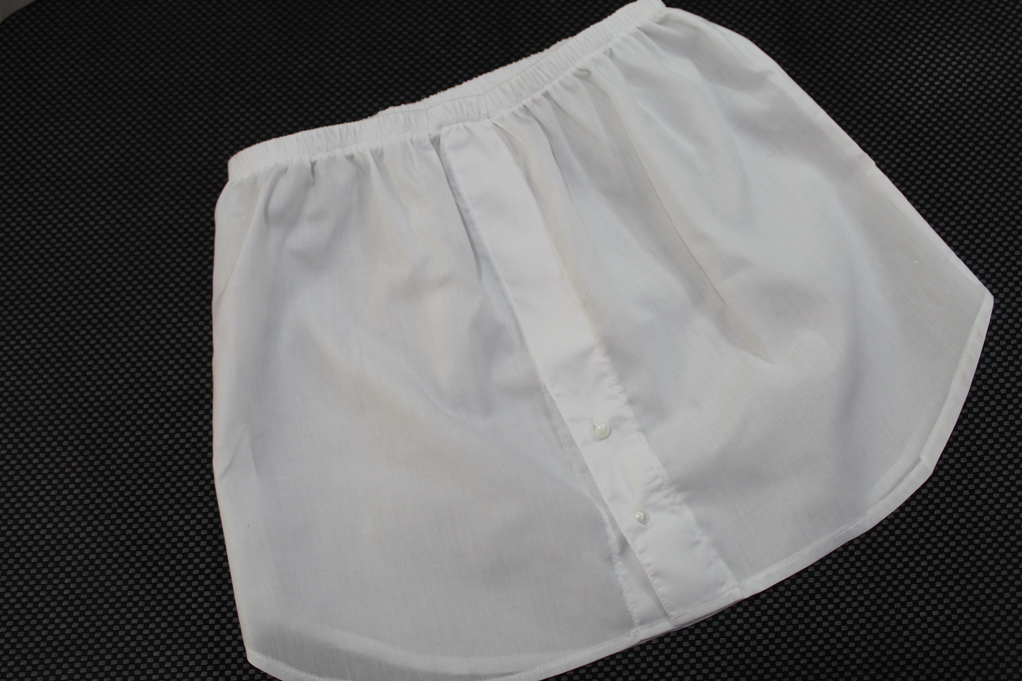 Casual streetwear featuring a long cardigan paired with light jeans, ideal for a relaxed yet modest look, extension skirt.