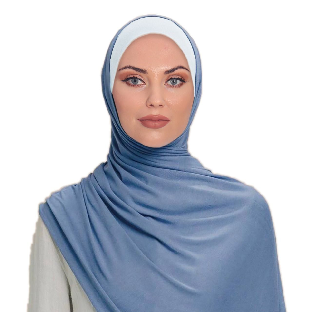 Front-facing portrait of a woman in a light blue hijab with a matching modest outfit, looking confident and elegant.