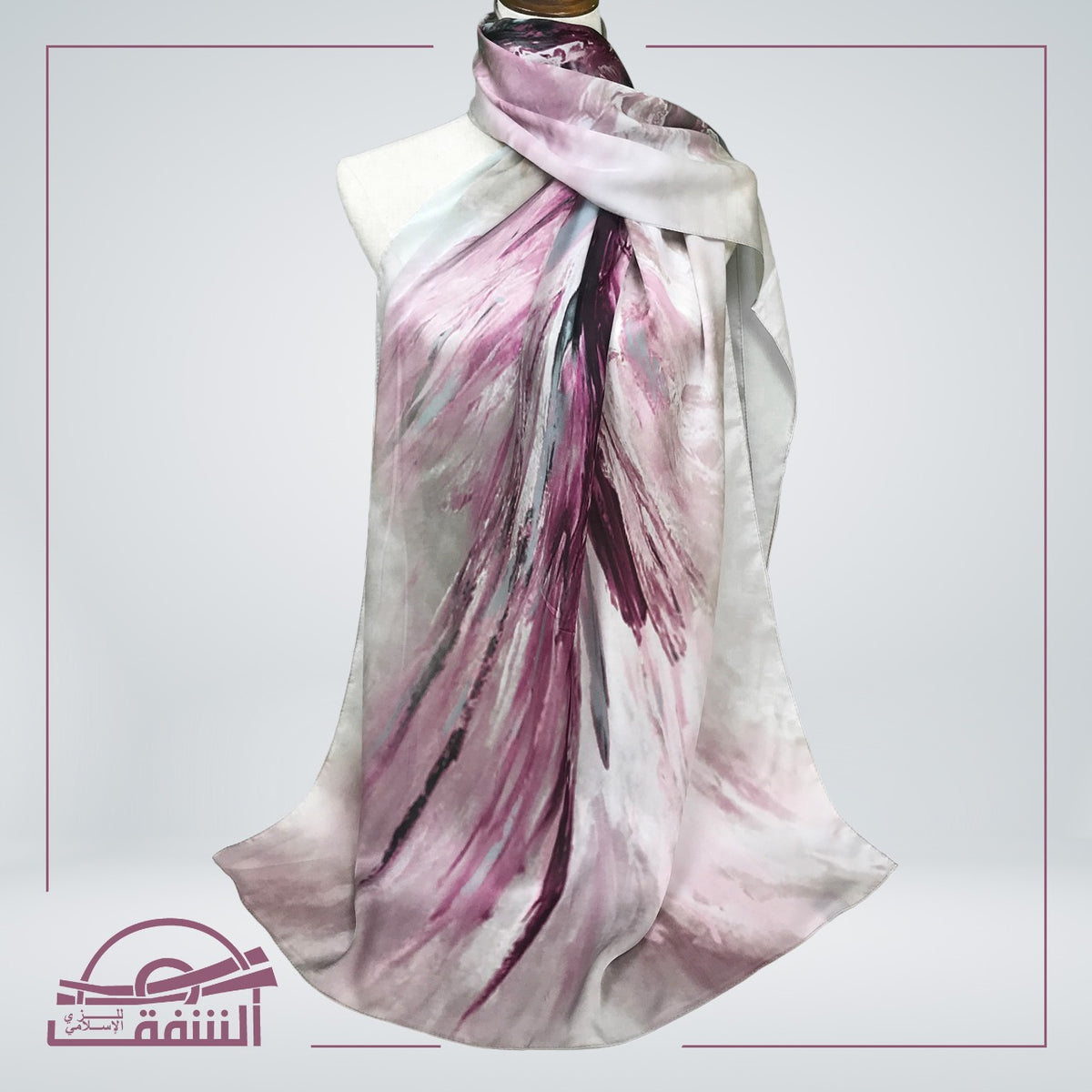 Flowy and lightweight silk hijab with a striking abstract pink and white print, perfect for formal wear.