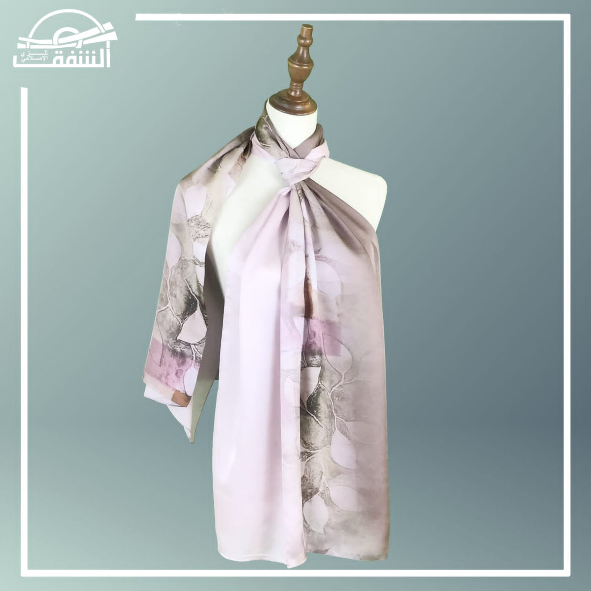 Luxury printed silk hijab with floral designs, hanging neatly to showcase their intricate patterns.