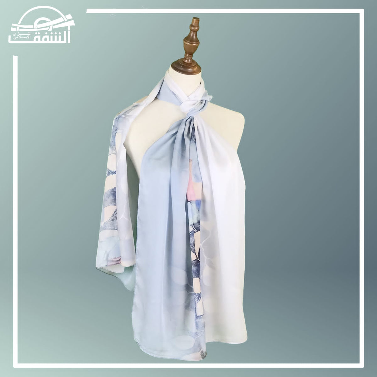 Elegant silk hijabs in soft pastel shades, displayed on a wooden hanger for a sophisticated look.